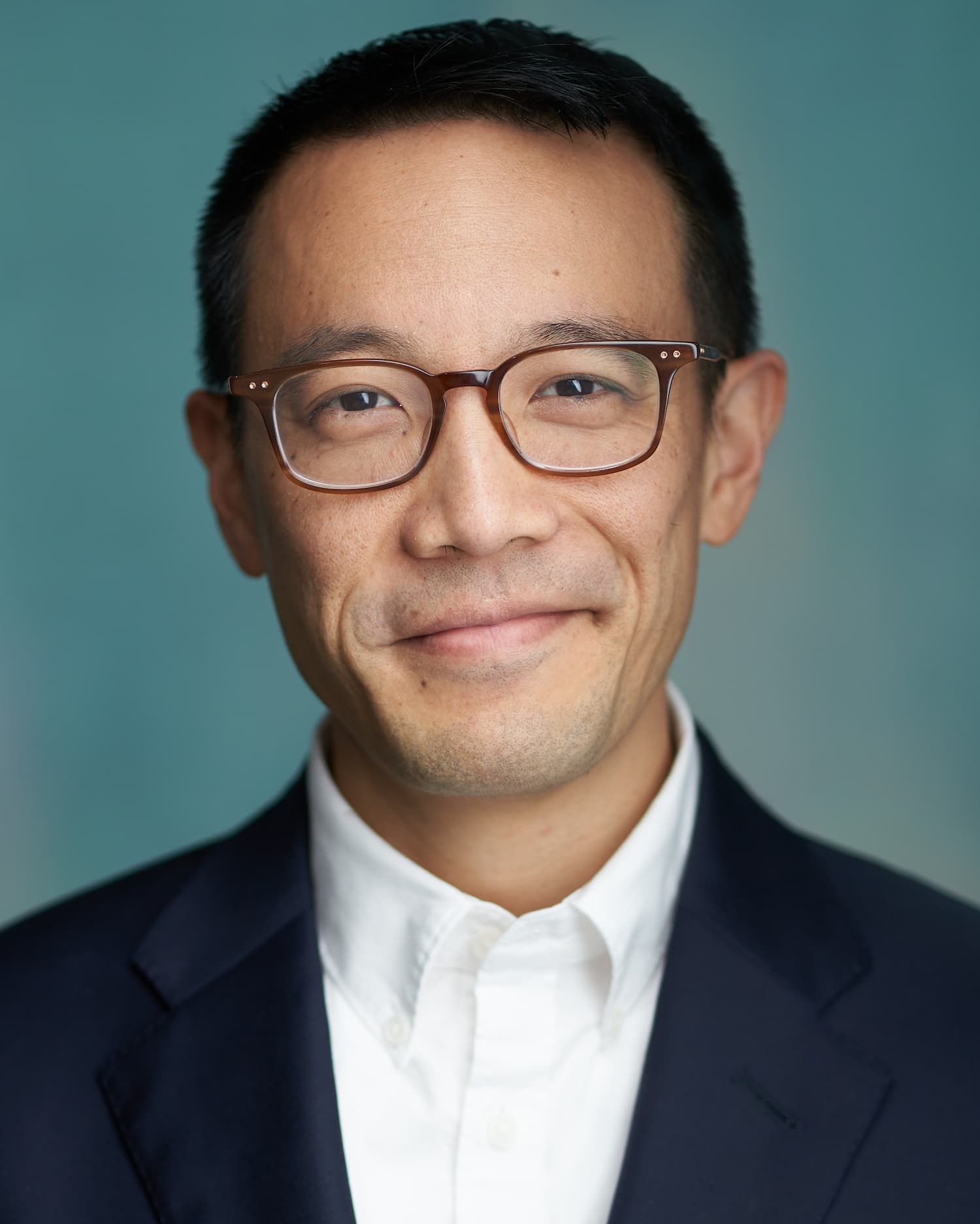 Professional headshot example with tight crop keeping focus on the face